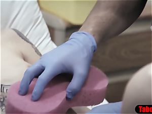 medic gives patient a sponge bath and vaginal explore